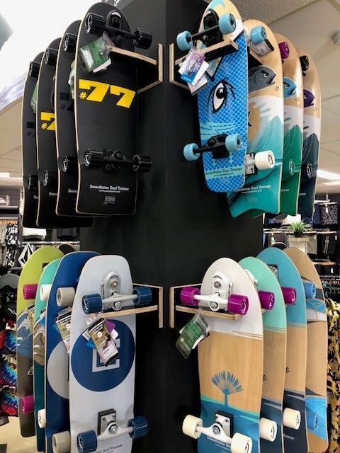 A Bunch of Skateboards Are Displayed in A Store — Slimes Boardstore in Erina, NSW
