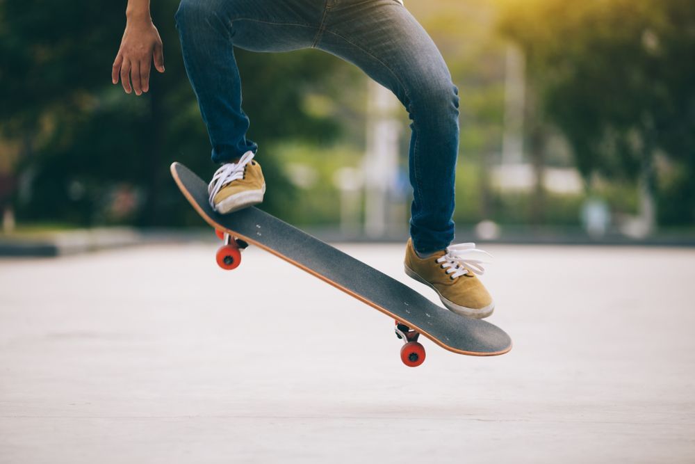 Skateboarder skillfully rides on a parking lot — Bodyboards in Erina, NSW