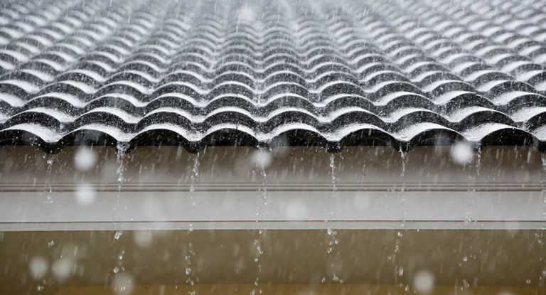 A Close Up of a Roof With Rain Falling on It. — Woodger's Metal Roofing Specialists Pty Ltd in Kempsey, NSW