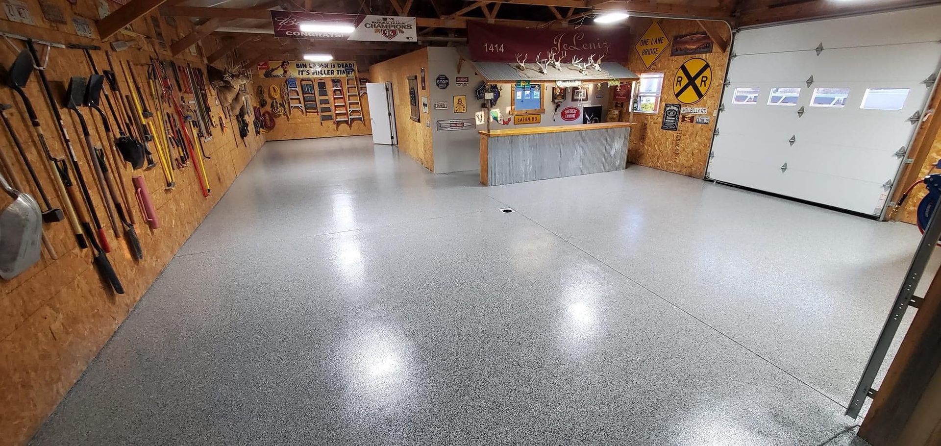 A garage with a concrete floor and a garage door.