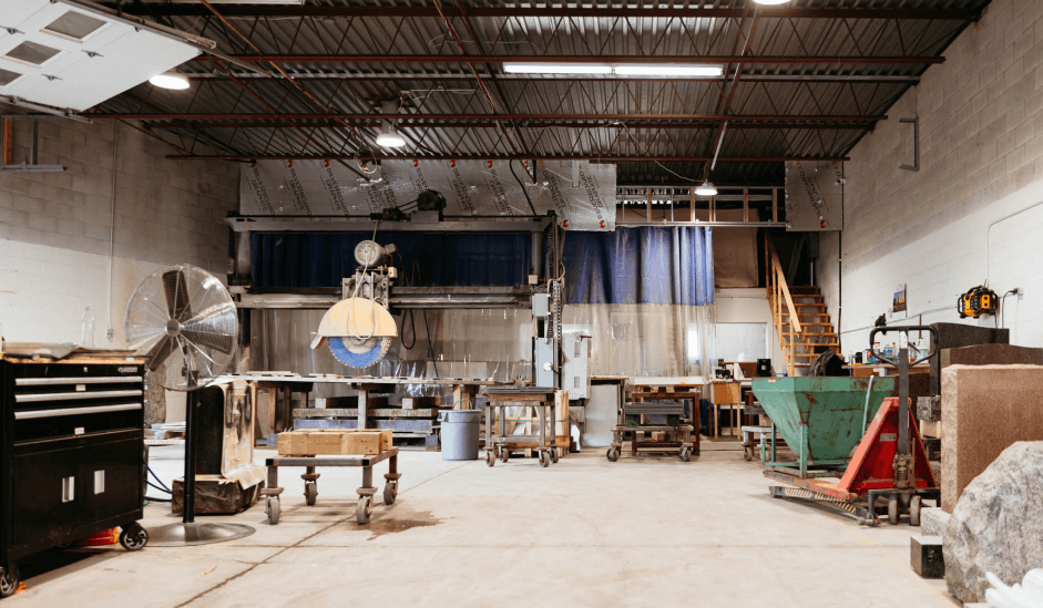 A large warehouse filled with lots of machinery and tools.