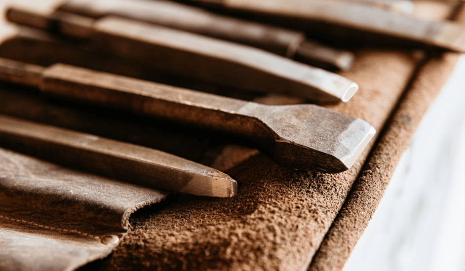 A close up of a bunch of tools on a table.