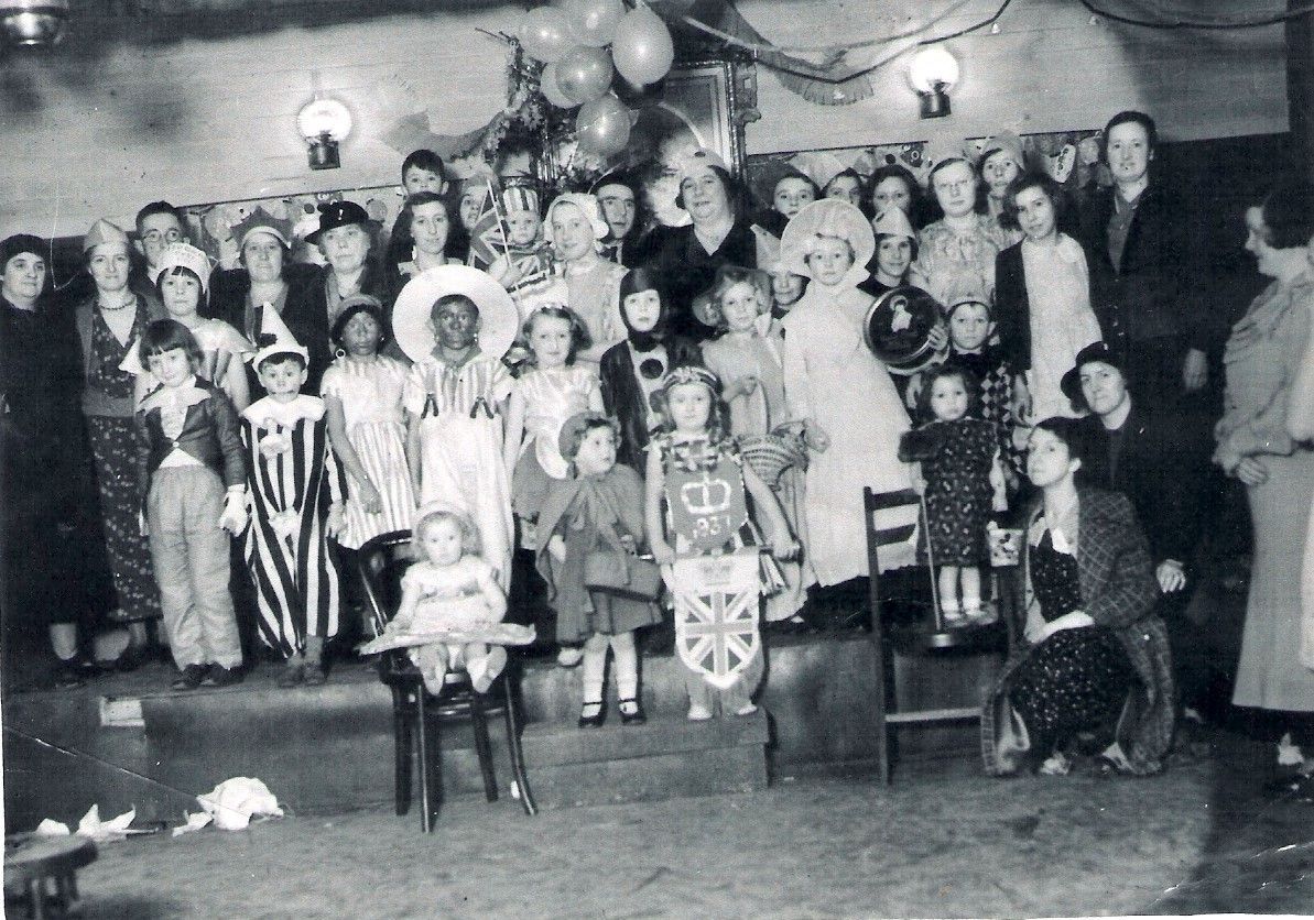 The Reading Rooms at Shincliffe Colliery. Charles W. Robinson is in the back row 3rd from the left. His daughter, Joan, is in the centre of the picture with a flag.