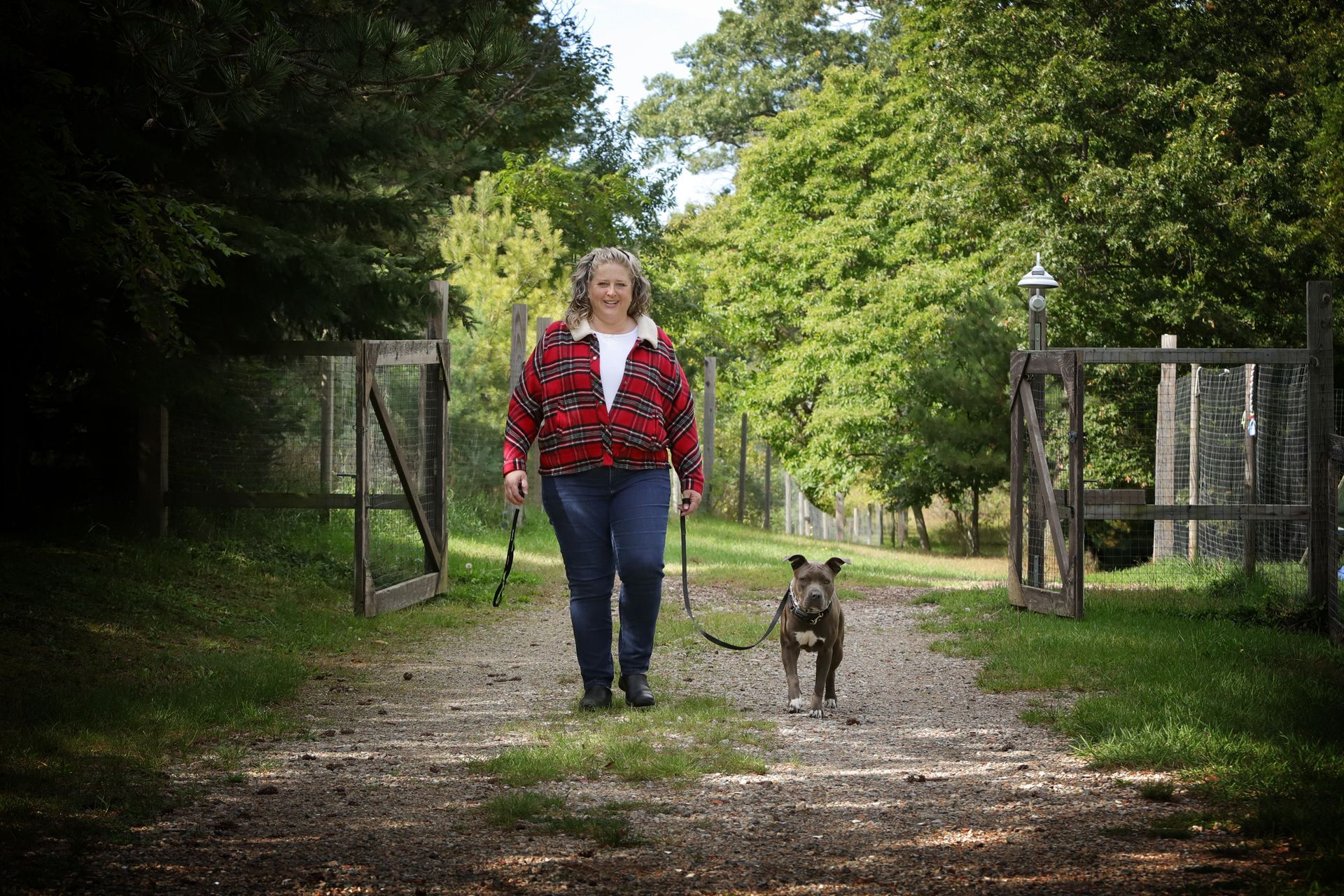 Traverse City Dog Trainer walks a dog with good leash manners.
