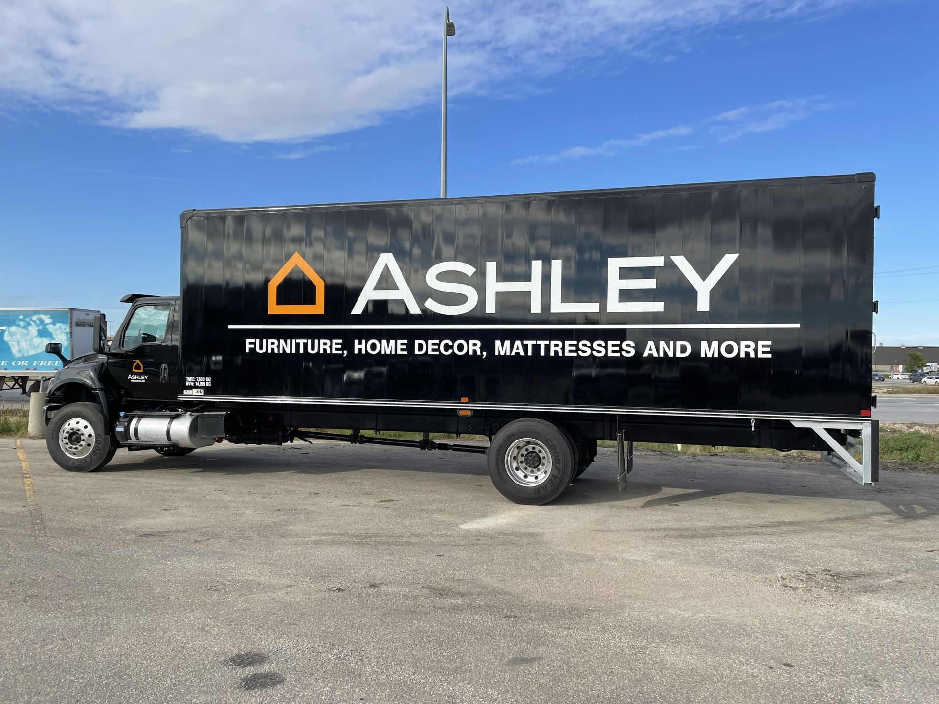 An ITB Trucks Dry Freight for ashley truck is parked in a parking lot.