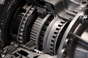A close up of a gearbox in a car.