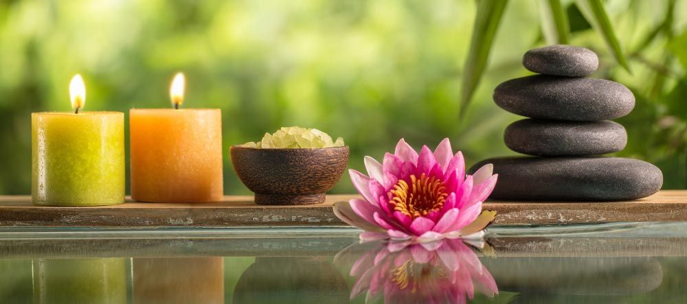 A Candle, Flower, and Balance Stones for Massage — Newark, OH — Tracy Reed LMT