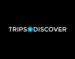 The logo for trips to discover is on a black background