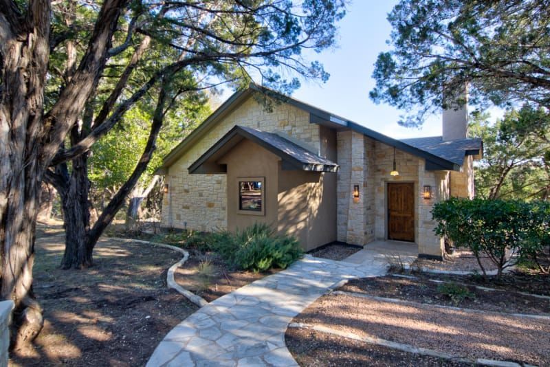 A house with a stone walkway leading to it