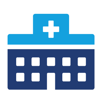 A blue hospital building with a white cross on top.