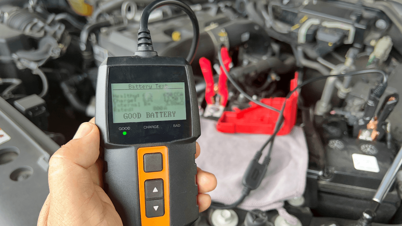 a mechanic testing a battery on-site