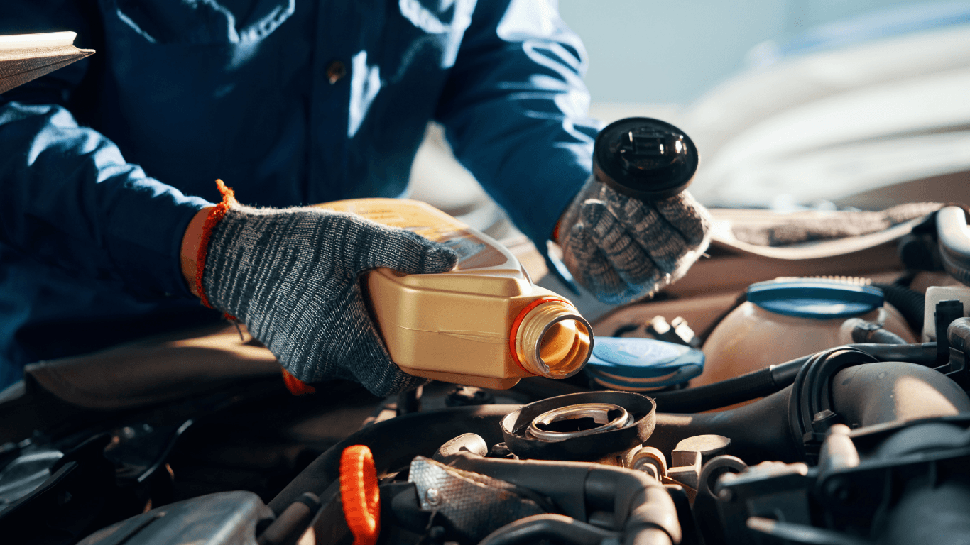 a mechanic doing an at-home oil change