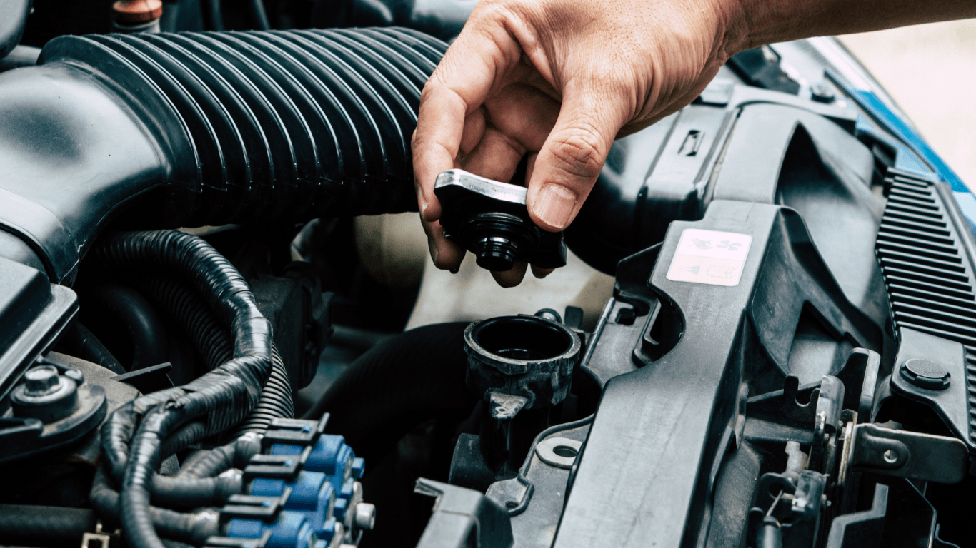 a mechanic changing radiator fluid