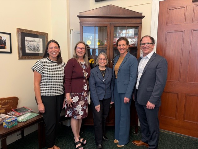 Advocates posing with members of Congress