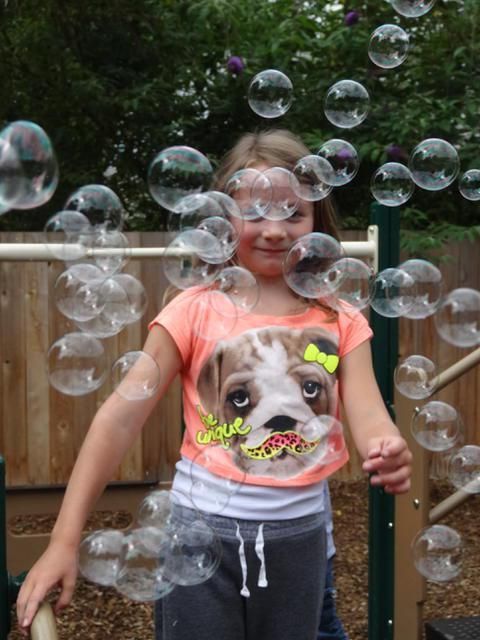 Girl surrounded by bubbles