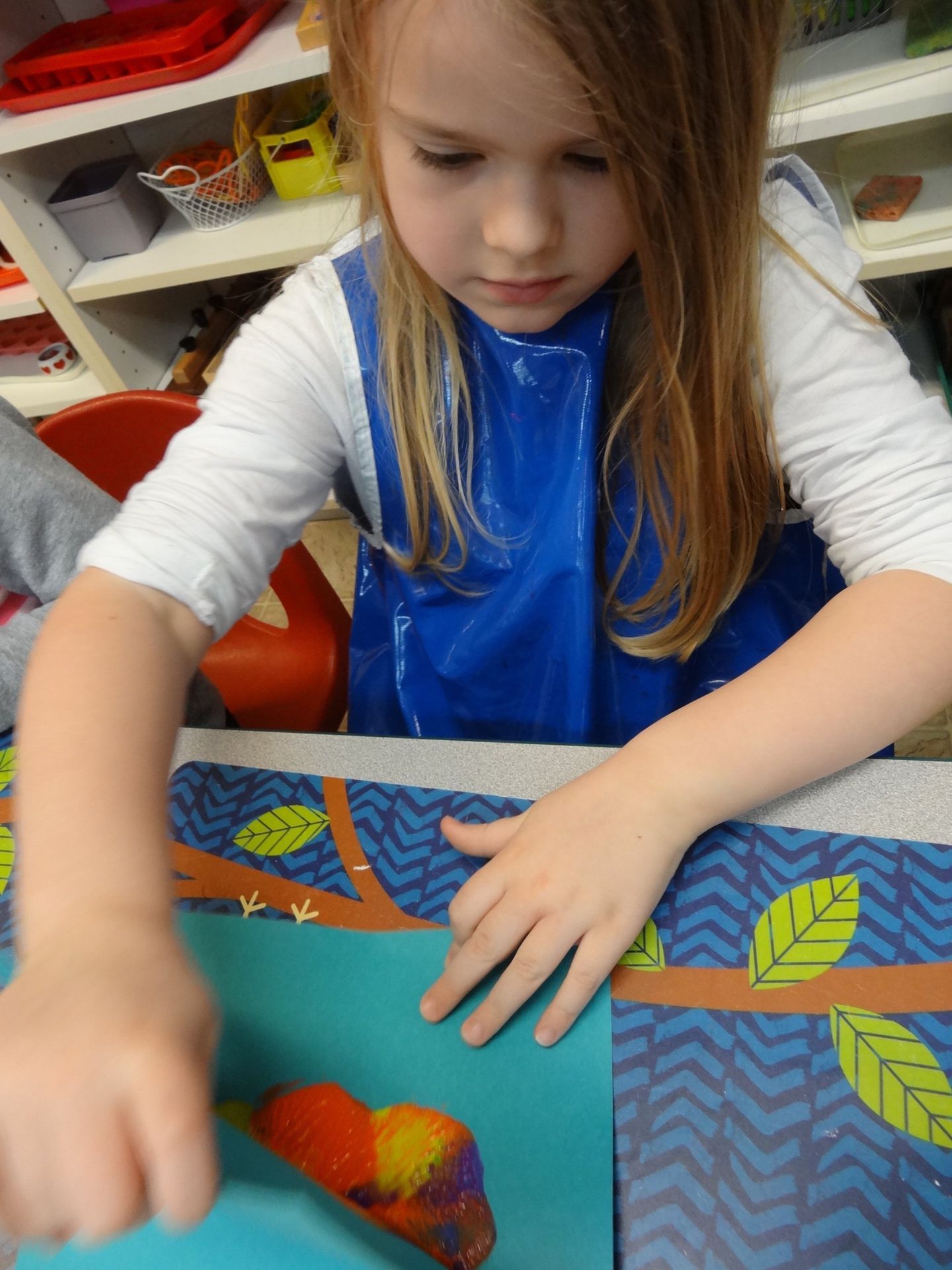 Girl in blue smock