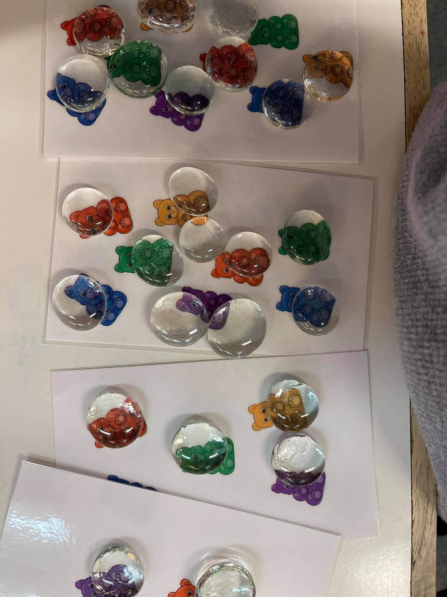 Rows of colored gems glued to white cards