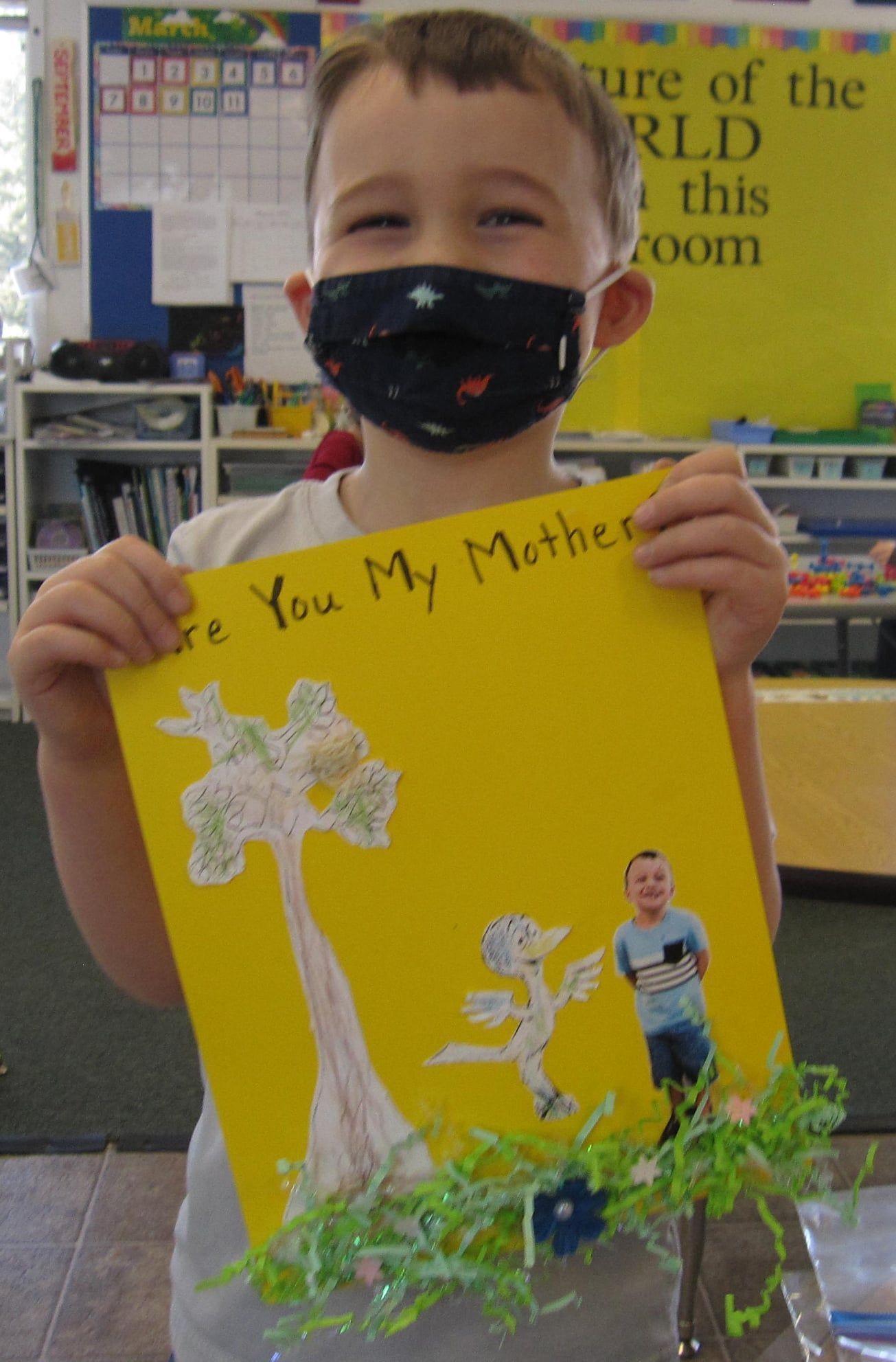 Boy holds drawing 