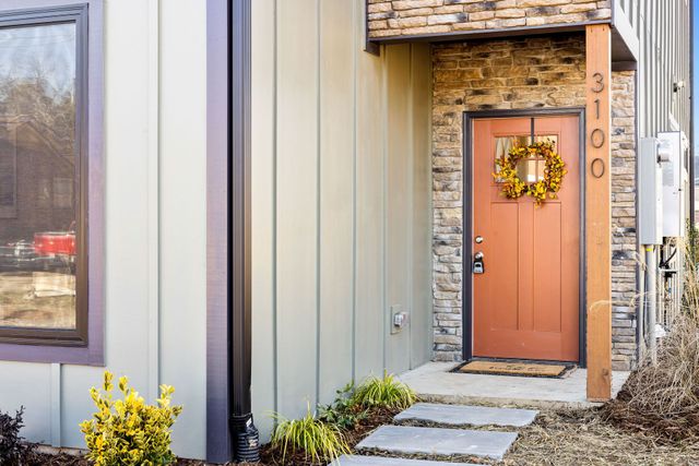 exterior walls with siding and front house door