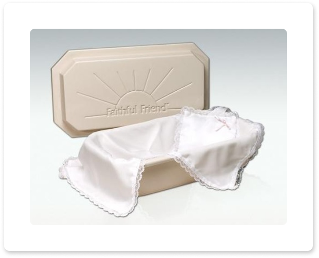White baby blanket draped over a beige Keepsake Memories box