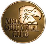 Gold NRA Gold Medal Club emblem with gold text and eagle logo on a circular medallion