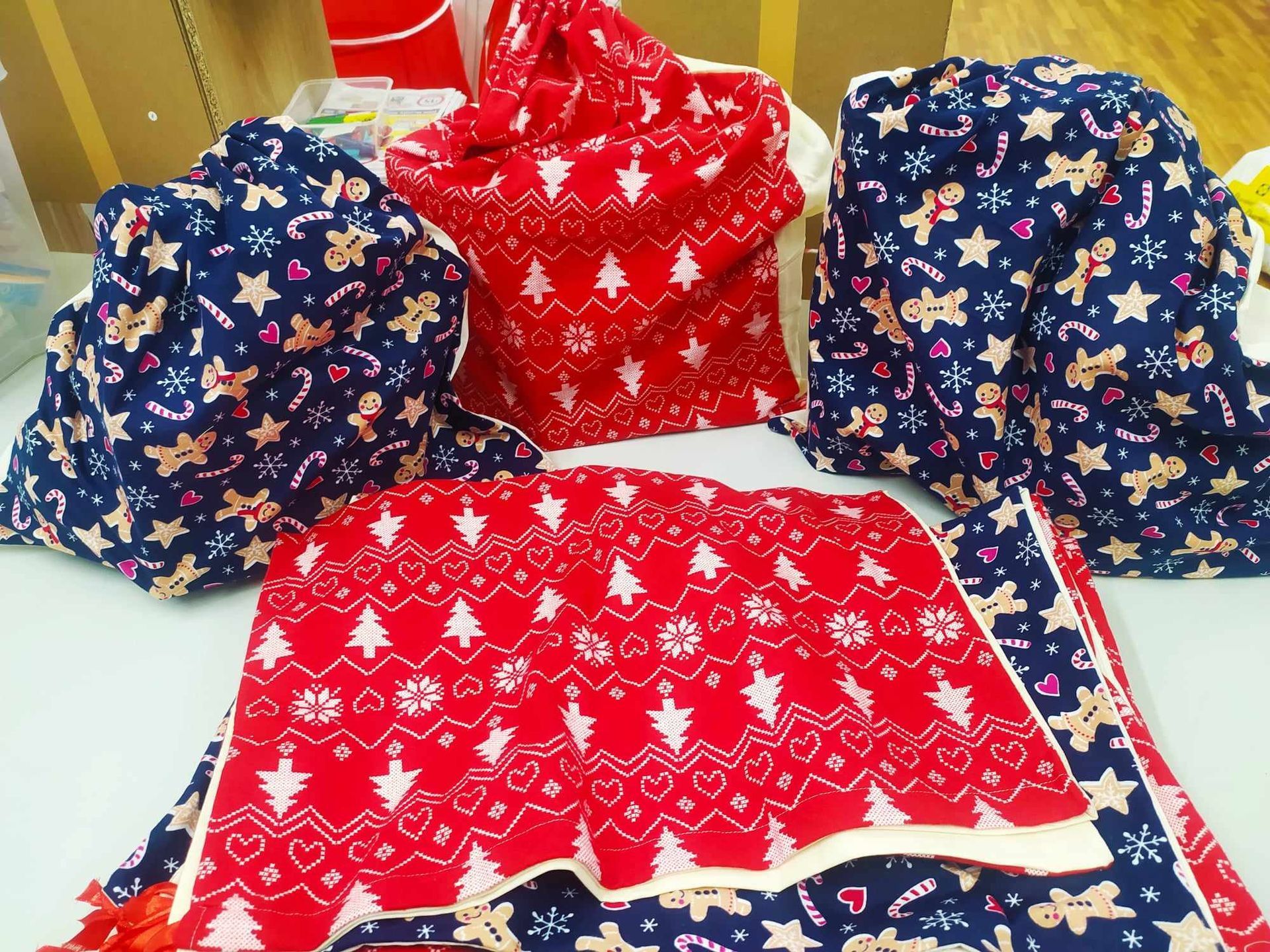 A red and blue scarf with christmas trees on it