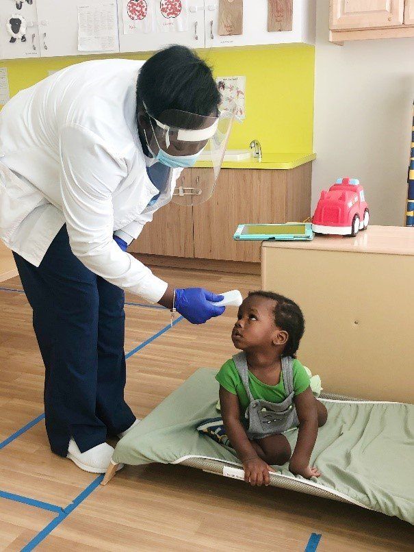 Evna assisting a child