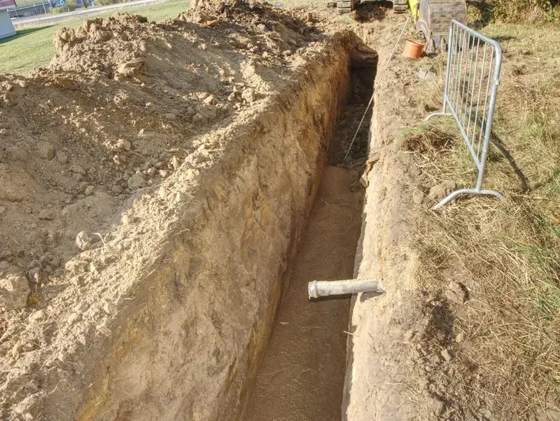 A Narrow, Excavated Dirt Trench Featuring a Single Pipe — Copp & Co Civil Plant Hire in Mount Julian, QLD