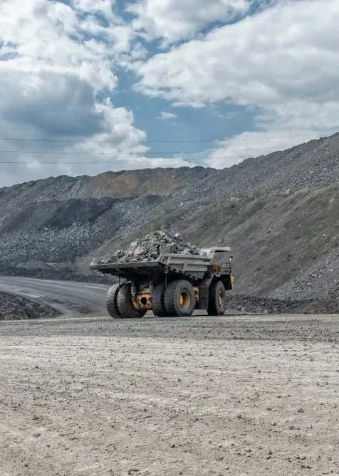 A Large Yellow Haul Truck Filled With Rocks — Copp & Co Civil Plant Hire in Cannonvale, QLD
