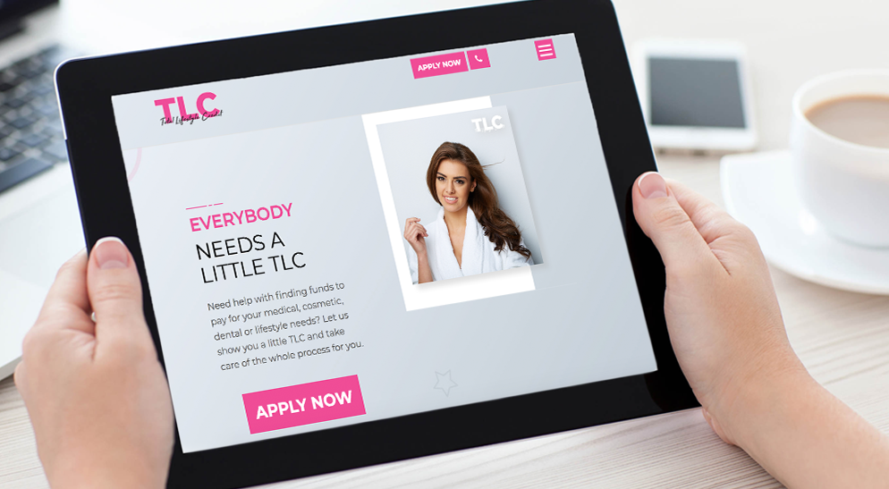 A person is holding a tablet with a picture of a woman on the screen.