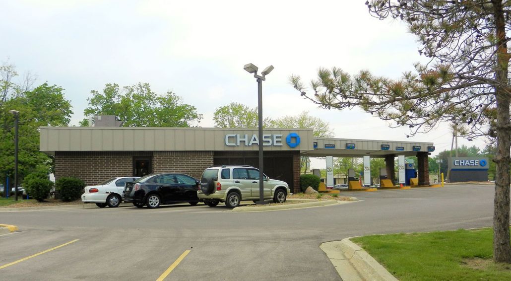 Chase bank branch with cars in the parking lot on a cloudy day