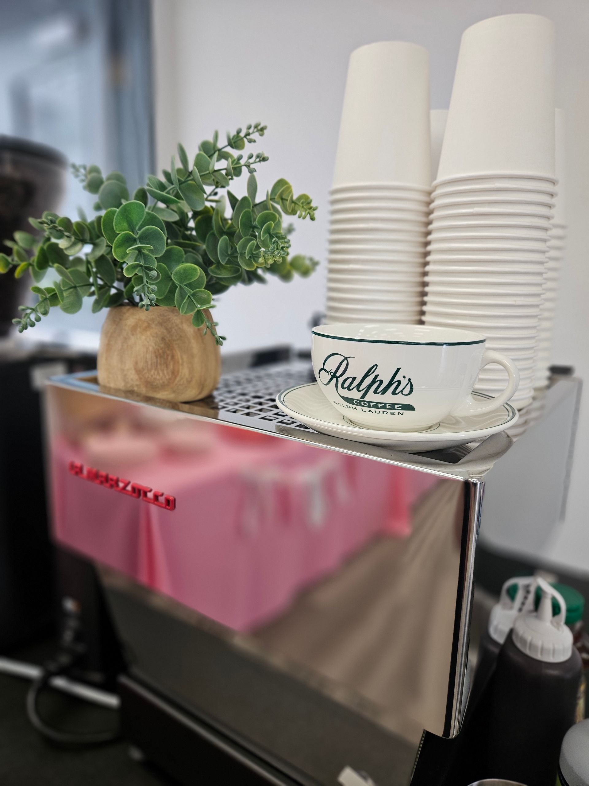 Coffee cups and event setup at the Bake and Grind mobile espresso bar