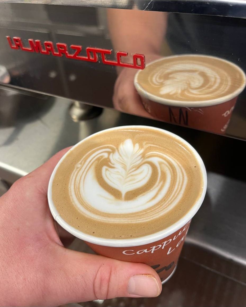 Handcrafted latte with heart latte art from the Bake and Grind mobile coffee cart