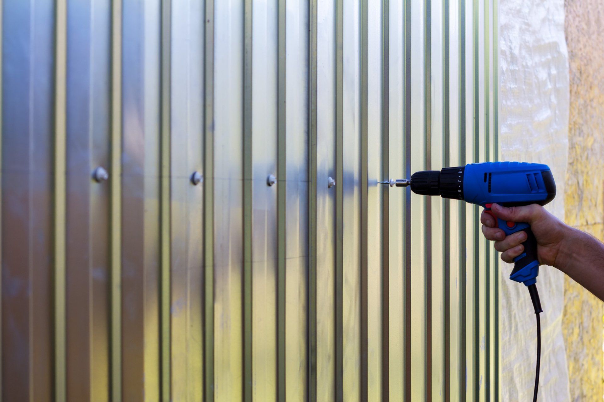 Drilling Screw on Roof Fence — San Diego, CA — Sam's Welding, Inc.