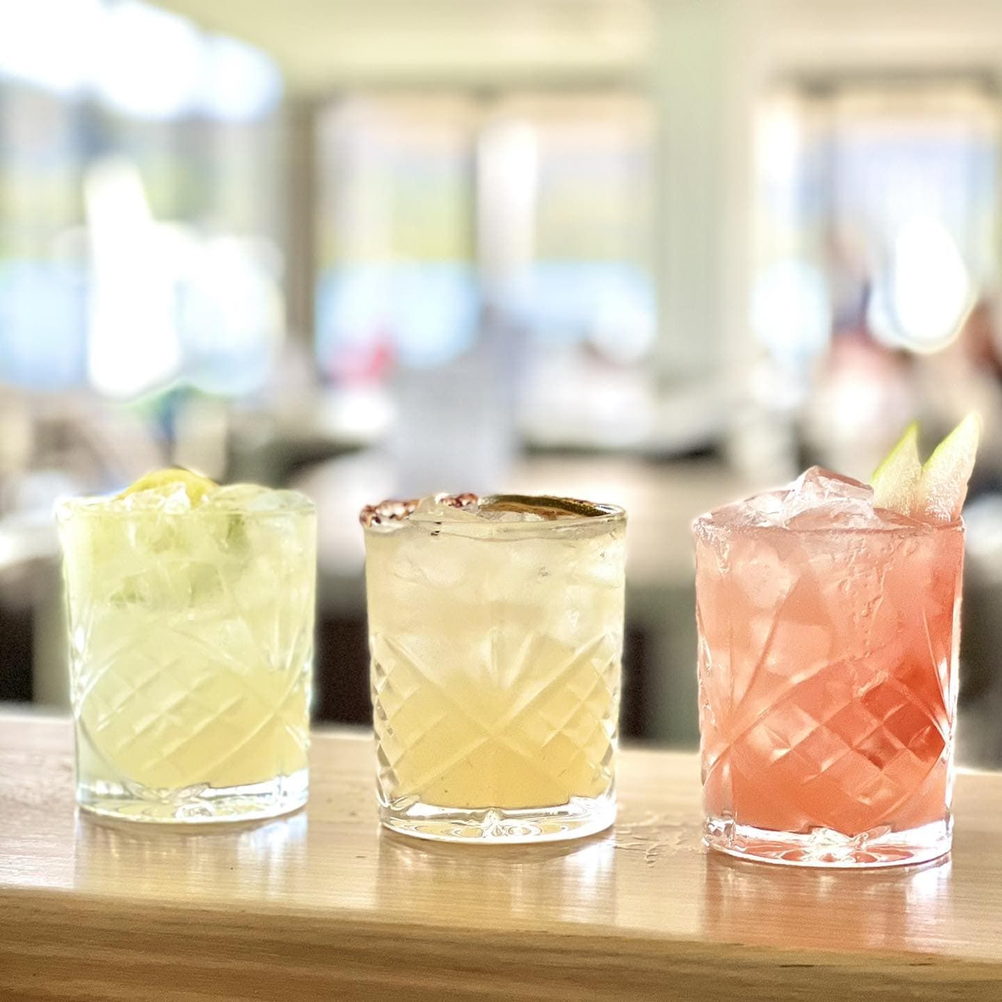 Three Different Coloured Drinks Are Sitting on a Wooden Table — Gosford Sailing Club in Gosford, NSW