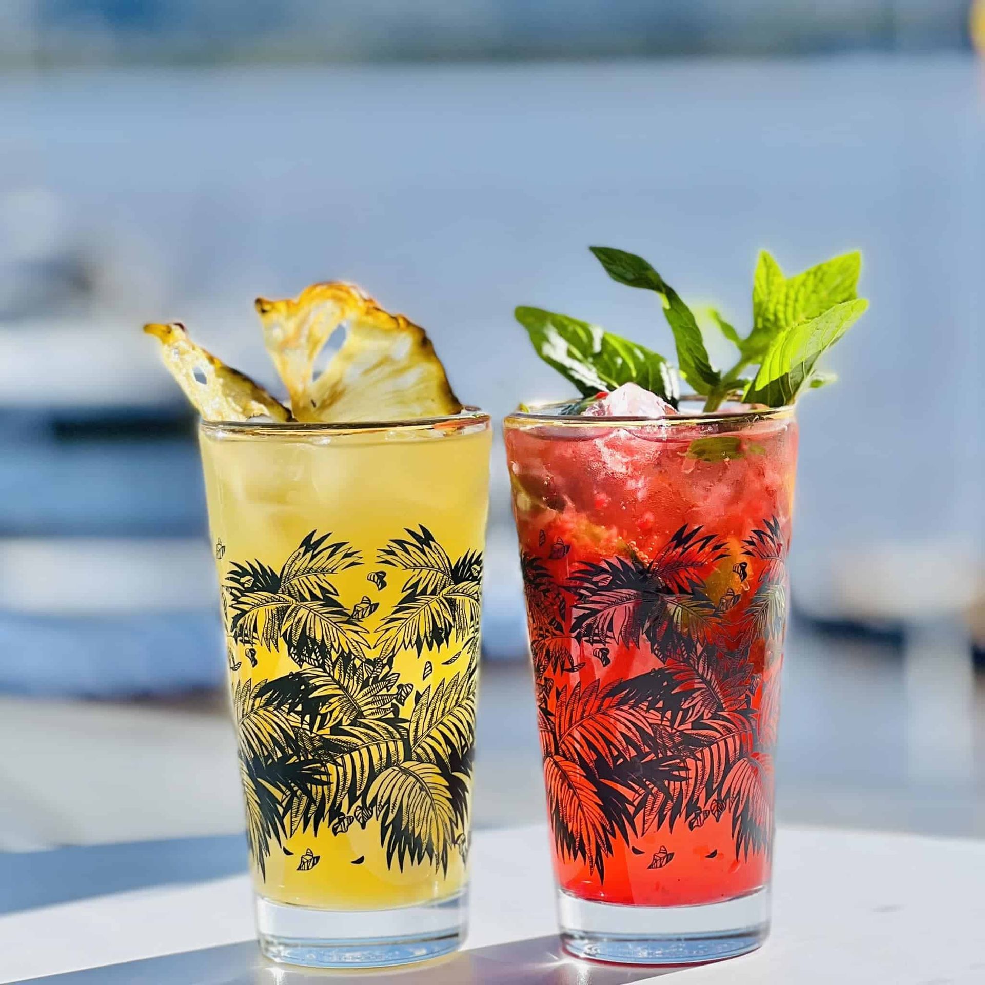 Two Glasses of Drinks One Yellow and One Red Are on a Table — Gosford Sailing Club in Gosford, NSW