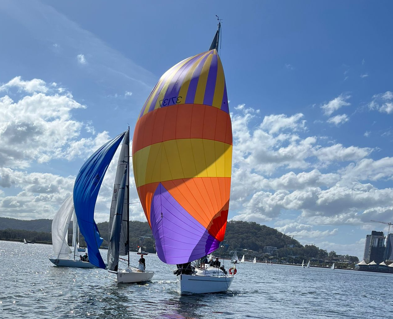 sailboats racing on choppy water under a partly cloudy blue sky — Gosford Sailing Club in Gosford, NSW