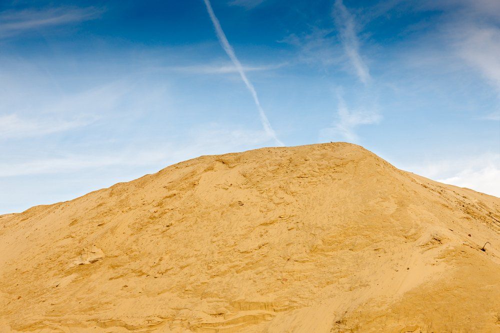 Red Tipper Truck Dumping Sand — Tipper Truck Hire In Port Macquarie, NSW