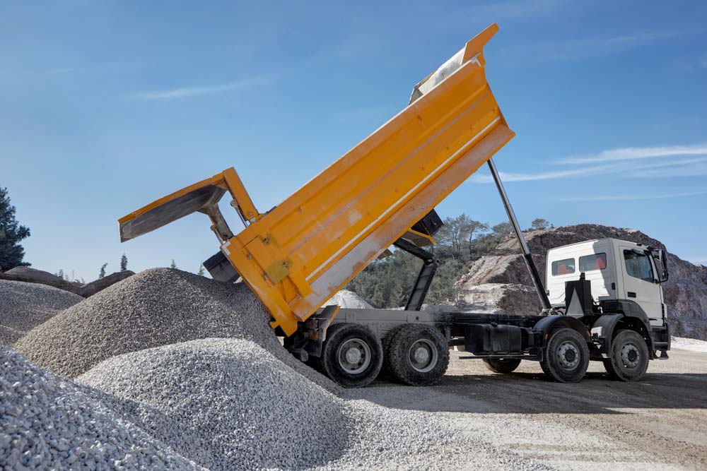 Truck Unloading Gravel — Tipper Truck Hire In Port Macquarie, NSW