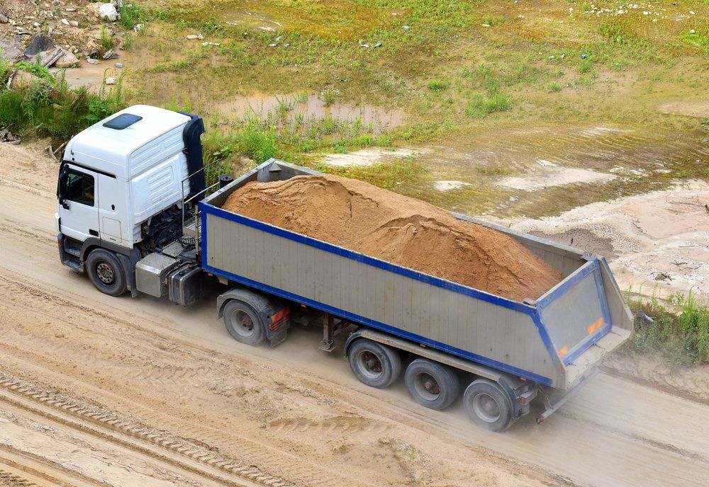 Tipper Truck Working In Open Pit Mine — Tipper Truck Hire In Port Macquarie, NSW