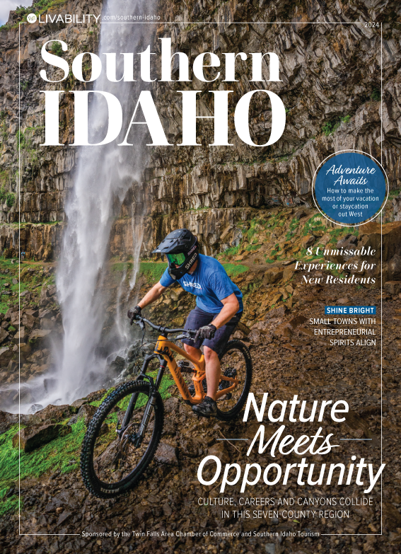 A man is riding a bike in front of a waterfall on the cover of a magazine.