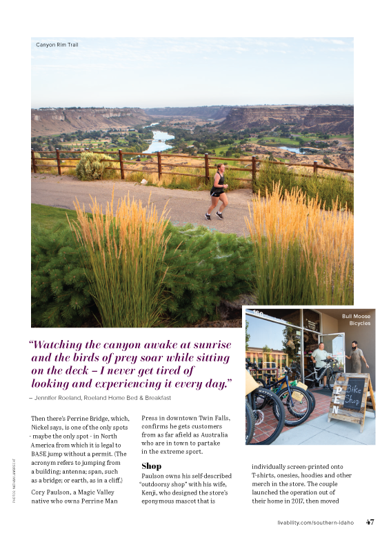 A woman is riding a bike on a path next to a river.