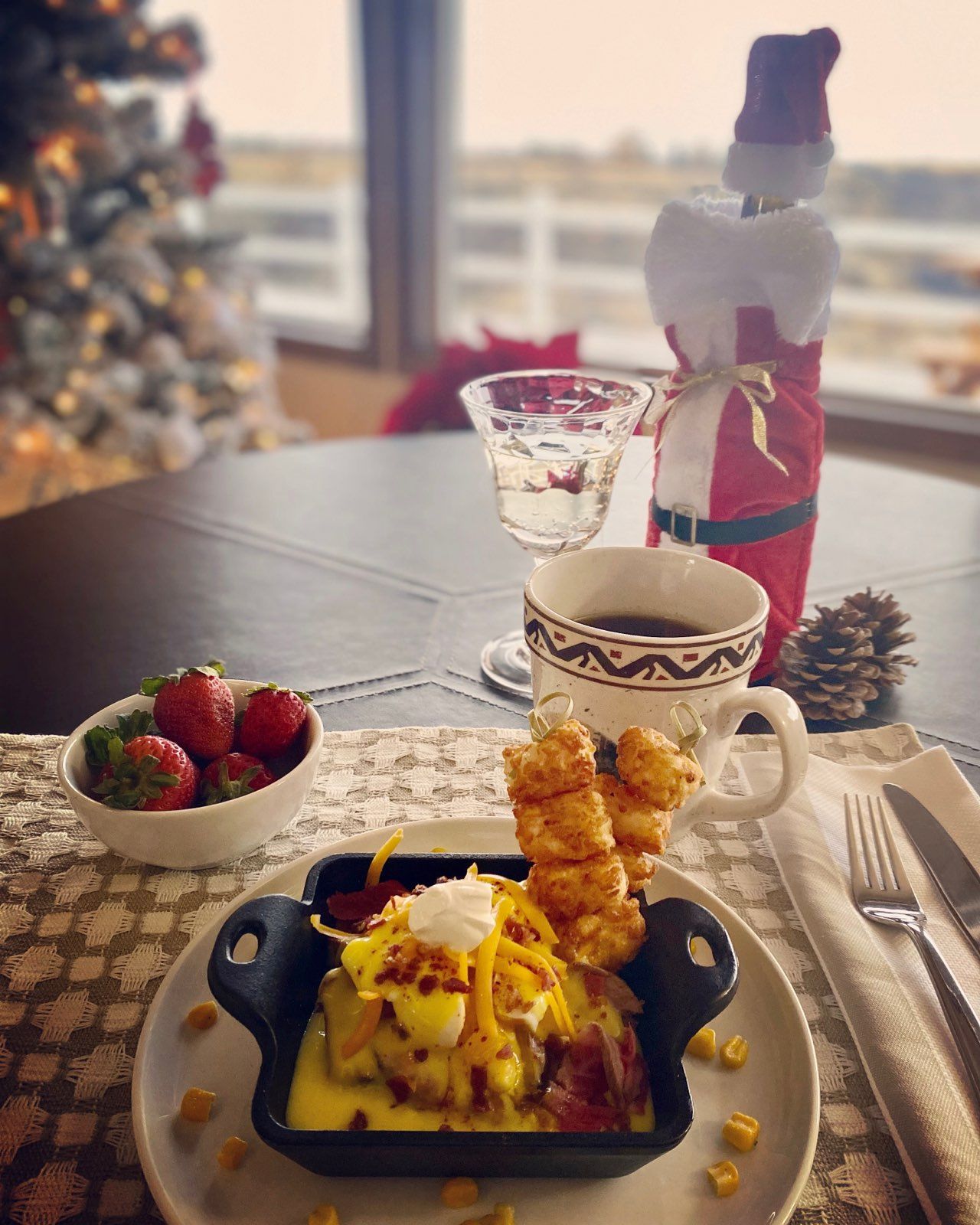 A table with a plate of food and a cup of coffee.