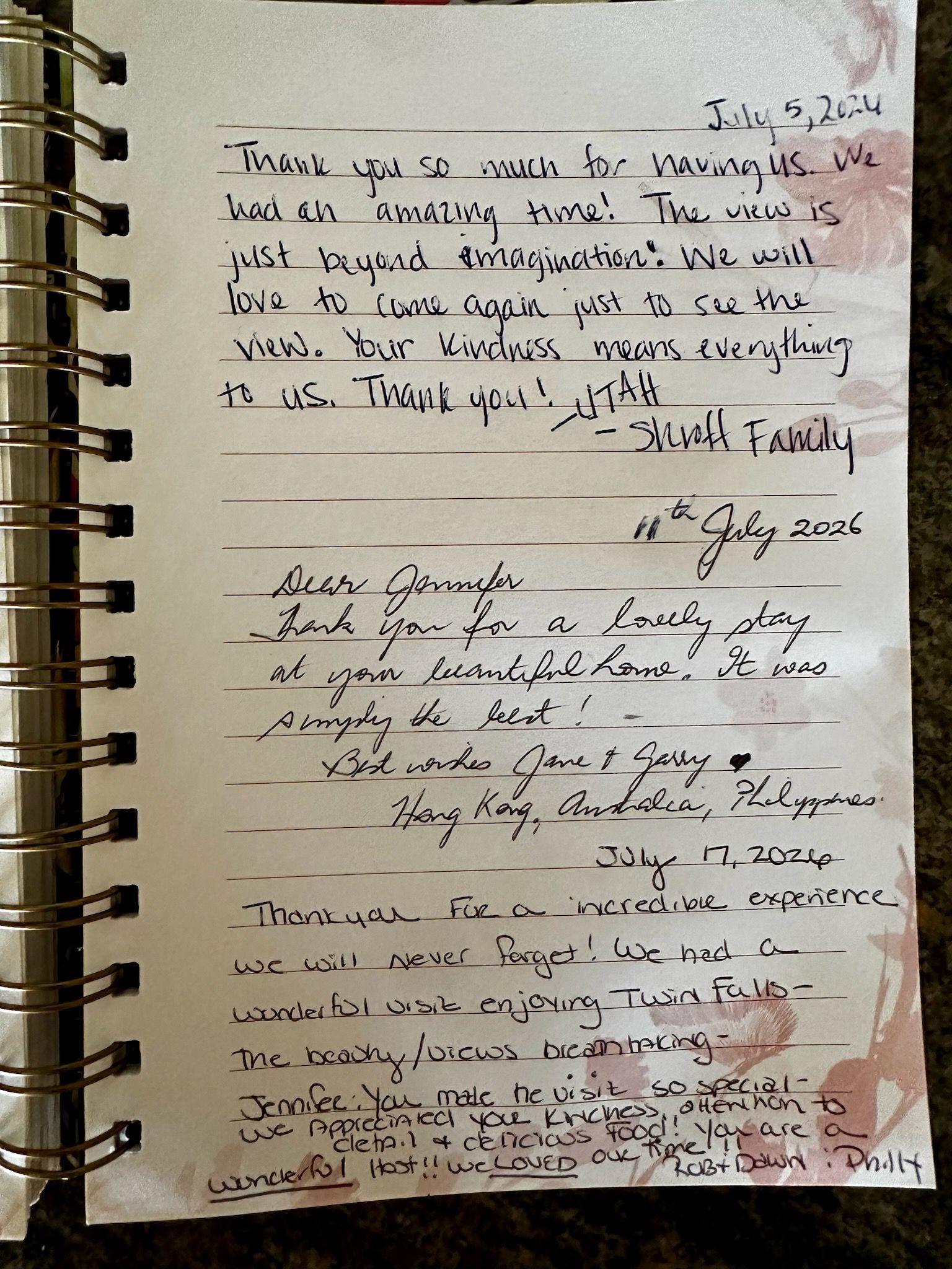 Handwritten notes on a lined notebook page with dark ink and red marks, clipped in a spiral binder.