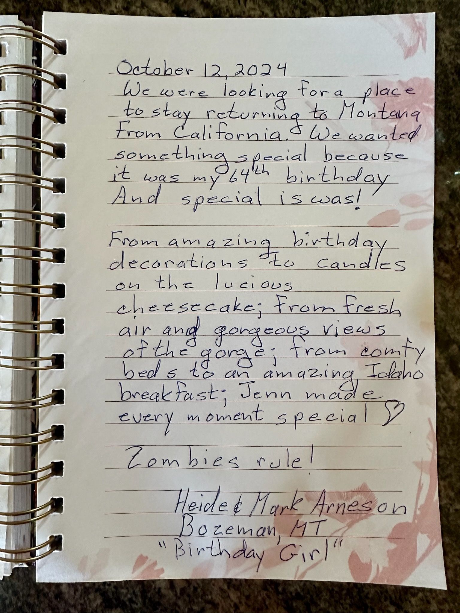 Handwritten journal entry on a spiral-bound notebook. Writing mentions birthday celebrations, events, and