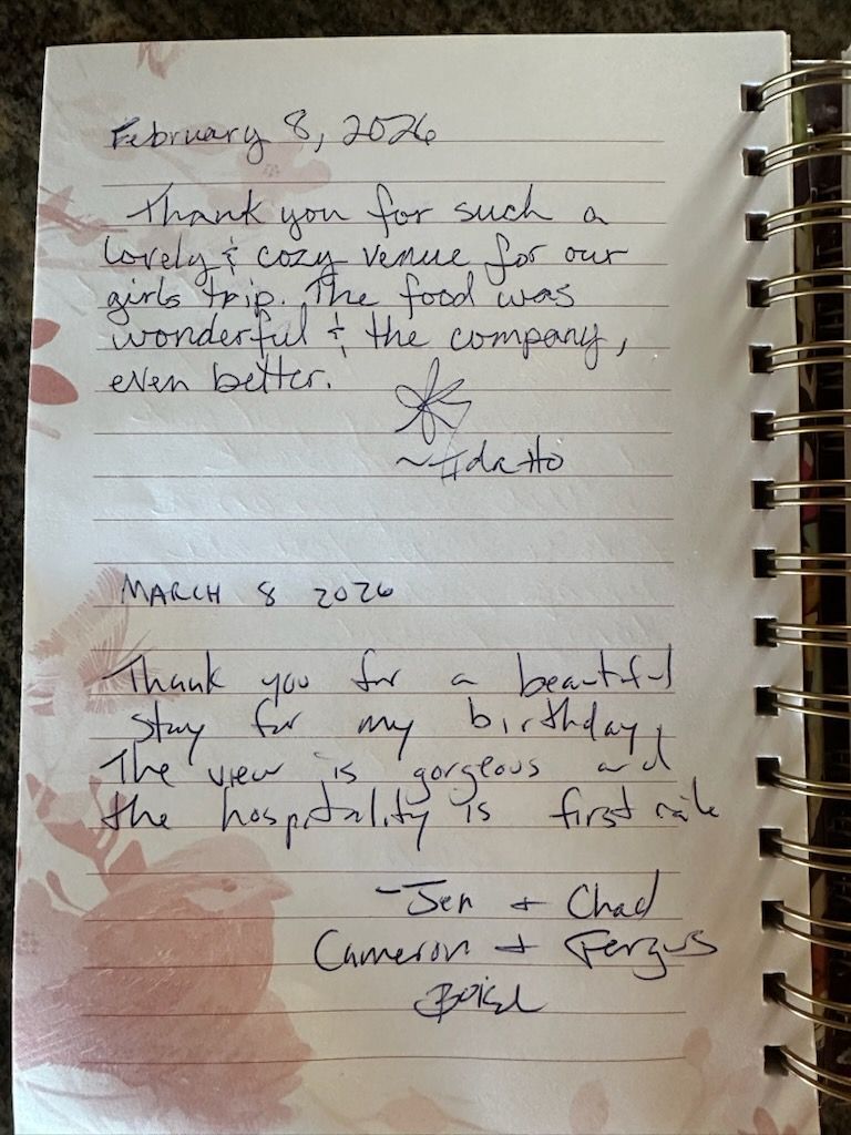 Handwritten notes on lined paper, with a red-stained lower left corner and spiral binding on the right.