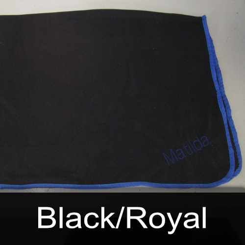 A black blanket with the name marida embroidered on it