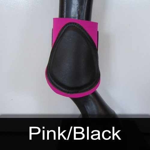 A close up of a pink and black boot on a horse 's leg