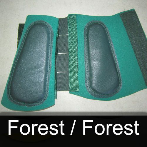 A pair of green knee pads with the words forest / forest below them