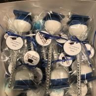Bag of blue-and-white bottled items with round labels and ribbon ties